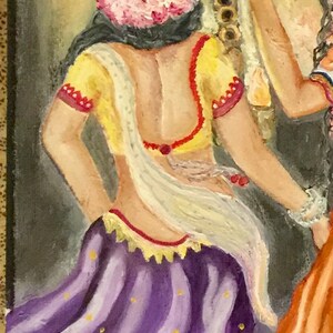 May include: Painting of two women in traditional Indian clothing. The woman in the foreground is wearing a purple skirt with gold dots, a yellow blouse with red trim, and a white shawl. The woman in the background is wearing an orange skirt with red trim and a white blouse.