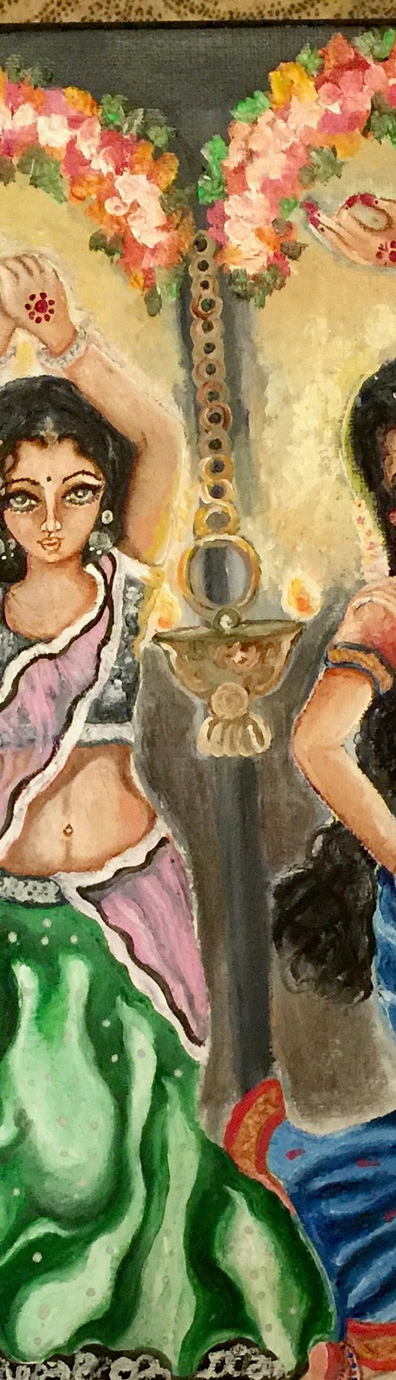 May include: A painting of two women in traditional Indian clothing, standing in front of a lit oil lamp. The women are wearing colorful saris and jewelry. The lamp is hanging from a chain and has a mirror on the side. The background is a dark blue.
