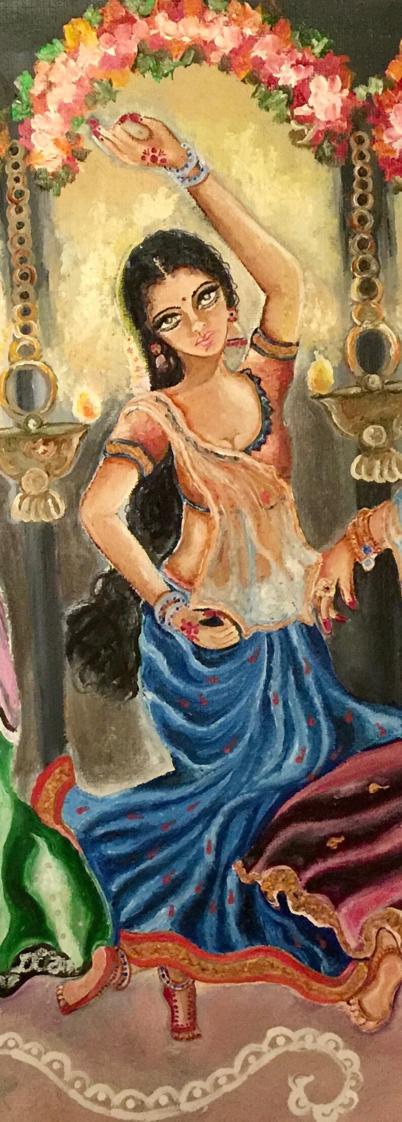 May include: A painting of a woman in a blue and gold sari, with her arms raised and hands in a dance pose. She is wearing jewelry and has a flower garland around her head. The background is a light yellow with a floral garland.