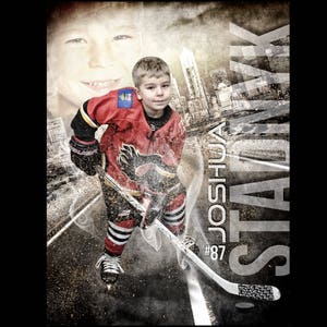 May include: A young hockey player wearing a red and black jersey with a white logo and the number 87 on the front. The player is holding a hockey stick and is standing on a street with a city skyline in the background.