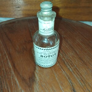 Französische Dentol 'Liquid Toothpaste' Flasche aus den 1930er Jahren. Mundwasserkaraffe. Vintage französische Apothekerflasche.