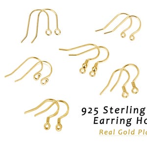 May include: A collection of gold-plated 925 sterling silver earring hooks in various styles, including plain wires, ball-end, and coil-end designs. The text "BEADNOVA" and "925 Sterling Silver Earring Hooks Real Gold Plated" is visible.