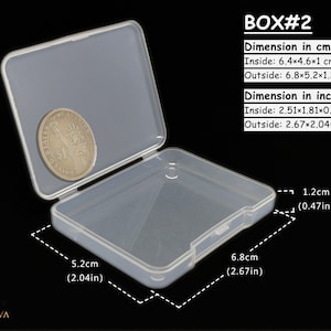 May include: A clear plastic storage box with a hinged lid. The box is 6.8 inches long, 5.2 inches wide, and 1.2 inches high. The box is labelled "BOX#2" and includes measurements in both inches and centimetres.