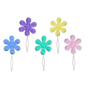 May include: Five colorful flower-shaped threaders with metal needles. The threaders are purple, blue, green, pink, and yellow.
