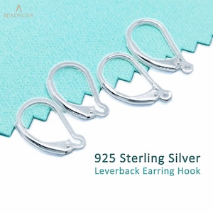 May include: Four silver leverback earring hooks on a turquoise background. 925 Sterling Silver Leverback Earring Hook.