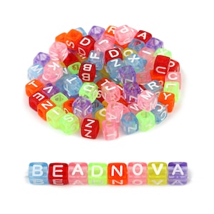 May include: A pile of colourful translucent plastic letter beads with white lettering. The beads spell out the word "BEADNOVA".