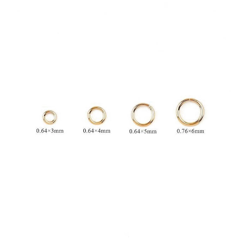 May include: Four gold jump rings in different sizes. The rings measure 0.64 x 3 mm, 0.64 x 4 mm, 0.64 x 5 mm, and 0.76 x 6 mm.