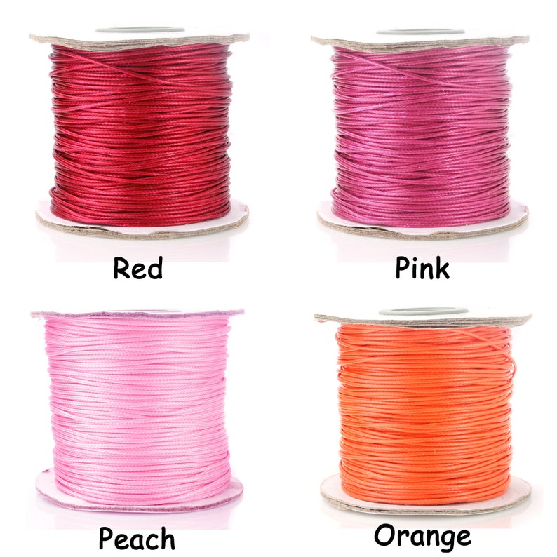 May include: Four spools of waxed cotton cord in red, pink, peach, and orange colors. The spools are on a white background.