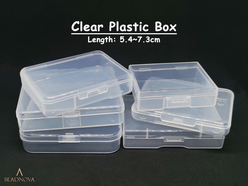 May include: Clear plastic storage boxes stacked on top of each other. The boxes are approximately 5.4 to 7.3 centimetres in length.  "Clear Plastic Box" and "Length: 5.4~7.3cm" are printed on the image.