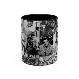 May include: Black and white ceramic mug with a collage of images of Elvis Presley. The mug features a black interior and a white exterior with a collage of images of Elvis Presley, including him playing a guitar, singing, and posing for a photo. The mug also features the text "Elvis Presley" and "International Hotel Presents Elvis".