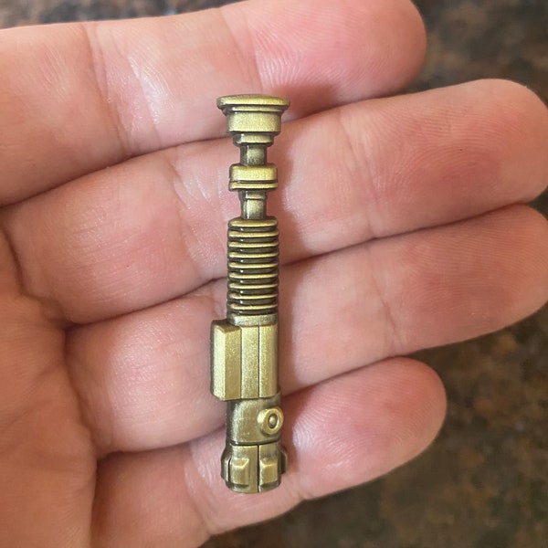 Star Wars Obi Wan Kenobi Lightsaber die cast pin badge.