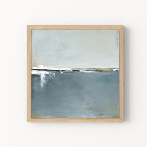 May include: Abstract landscape painting in a natural wood frame. The artwork features a horizon line with white, yellow, and green accents, above a muted blue-gray expanse. The painting evokes a sense of calm and serenity.