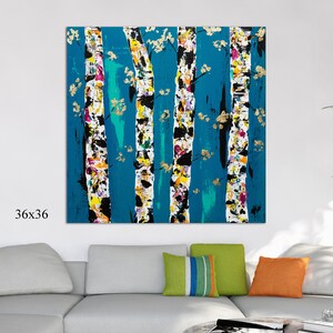 May include: Abstract painting of birch trees with a teal background. The trees are painted in white, black, yellow, pink, and gold. The painting is 36 inches by 36 inches.