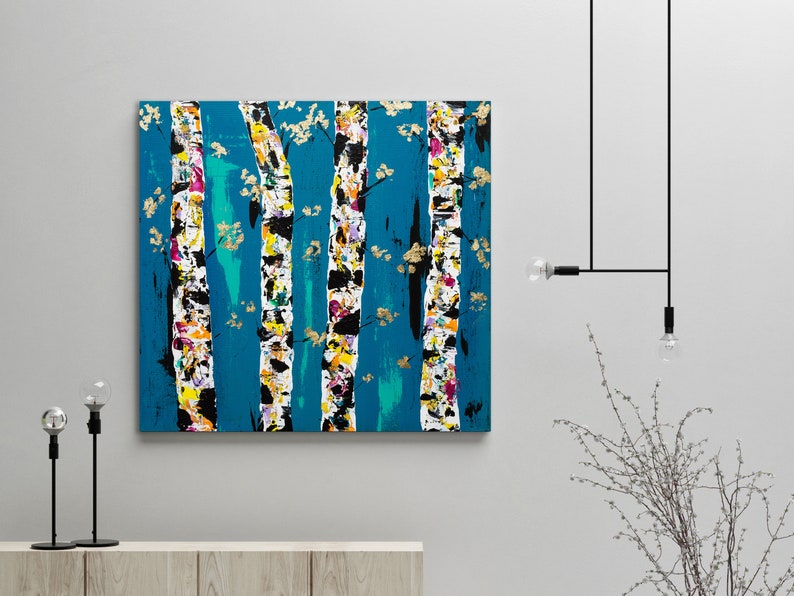 May include: Abstract painting of a forest scene with colorful trees on a teal background. The trees are painted in a stylized manner with white, black, and gold accents.
