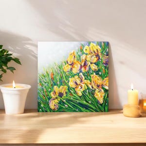 May include: A painting of yellow irises with green leaves and a white background. The flowers are painted in a loose, impressionistic style.