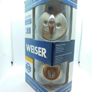 May include: A Weiser SmartKey deadbolt lock in a silver finish. The packaging features the Weiser logo and the text "Welcome Home".