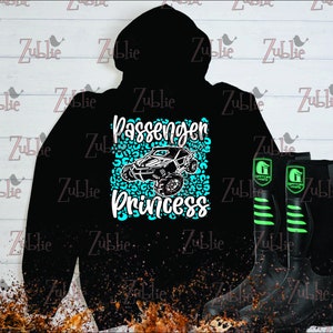 May include: Black hoodie with a turquoise and white graphic of a side-by-side vehicle with the text "Passenger Princess" on a cheetah print background.