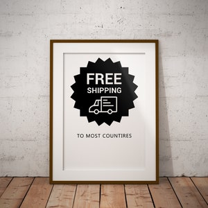 May include: A framed poster with a black and white graphic of a delivery truck with the text "FREE SHIPPING TO MOST COUNTRIES".