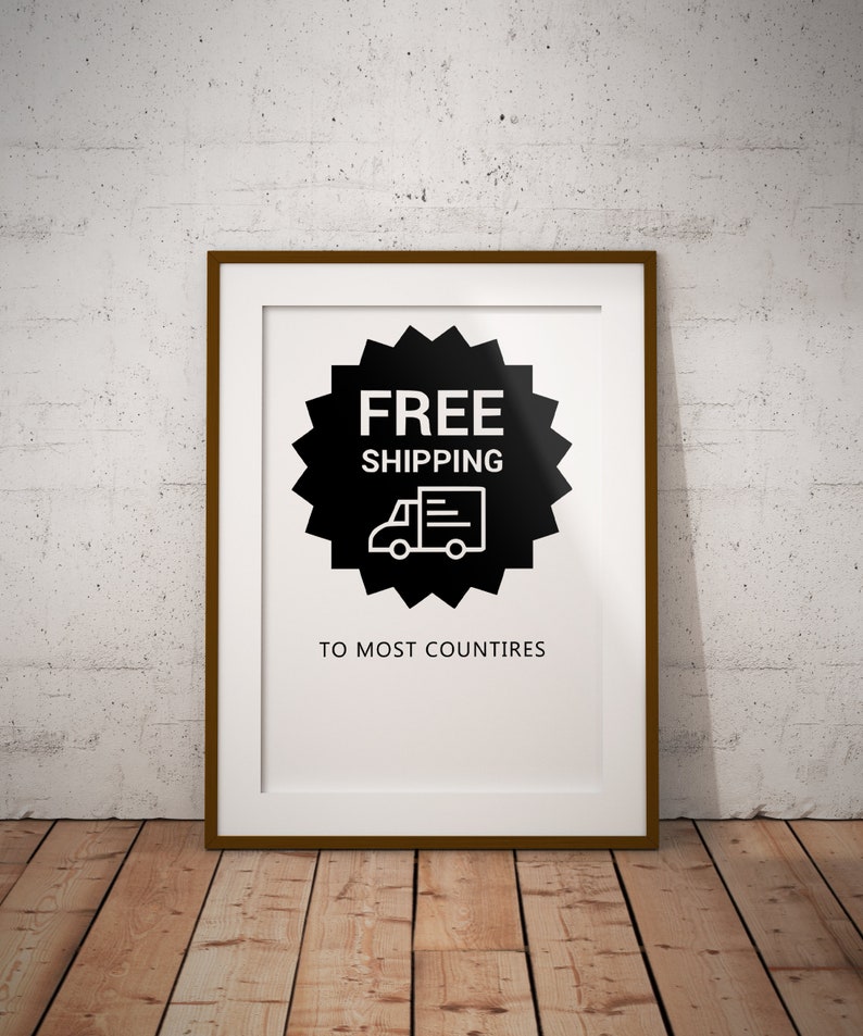 May include: A framed poster with a black and white graphic of a delivery truck with the text "FREE SHIPPING TO MOST COUNTRIES".