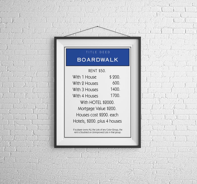 May include: A Monopoly game board property card for Boardwalk. The card is blue and features the property name, rent, and cost of houses and hotels. The card also includes the text "If a player owns ALL the Lots of any Color-Group, the rent is Doubled on Unimproved Lots in that group."