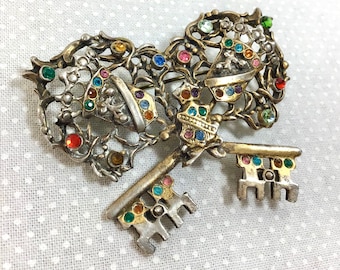 1960s Regal Rainbow Rhinestone Crossed Key brooch