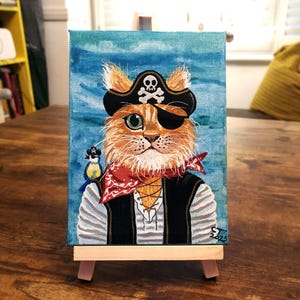 Toile pirate chat - unique en son genre - avec chevalet de présentation.