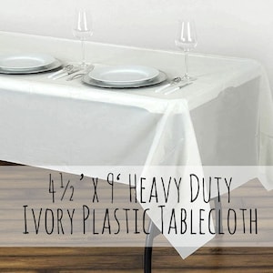May include: Ivory plastic tablecloth, 4 1/2' x 9' heavy duty, shown on a table with two place settings and glasses.