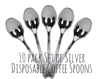 May include: A set of 10 silver disposable coffee spoons. The spoons are arranged in a star shape.