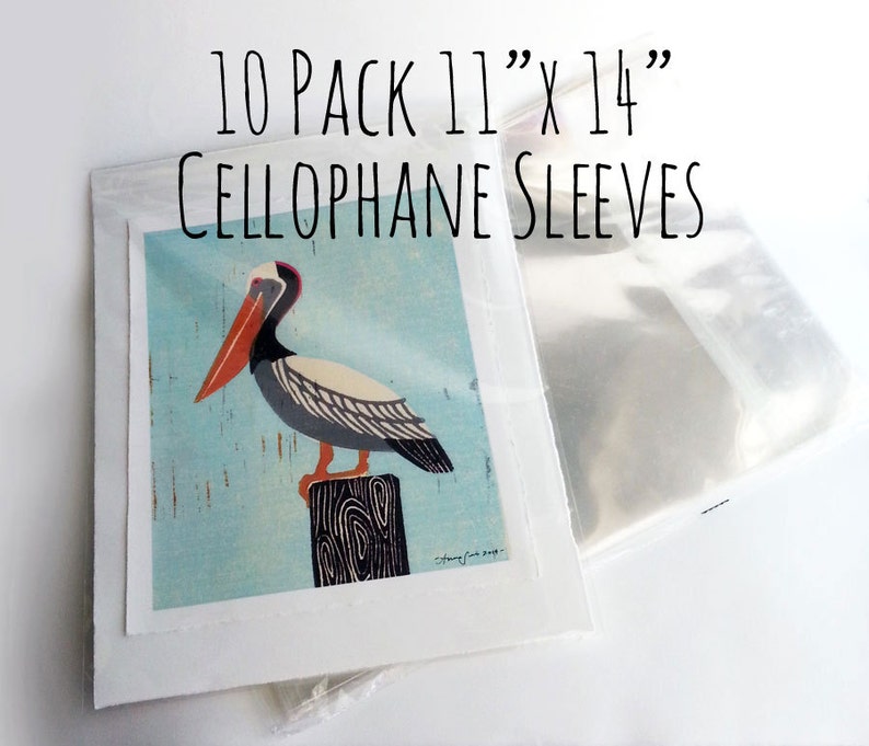 May include: A pack of 10 clear cellophane sleeves, each measuring 11 inches by 14 inches. The sleeves are designed to protect artwork, prints, or photographs. The image shows a pelican illustration on a blue background.