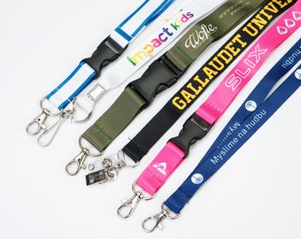 May include: A collection of six colorful lanyards with different text and designs. The lanyards are made of a soft, woven fabric and have a metal clip on one end and a plastic buckle on the other end.