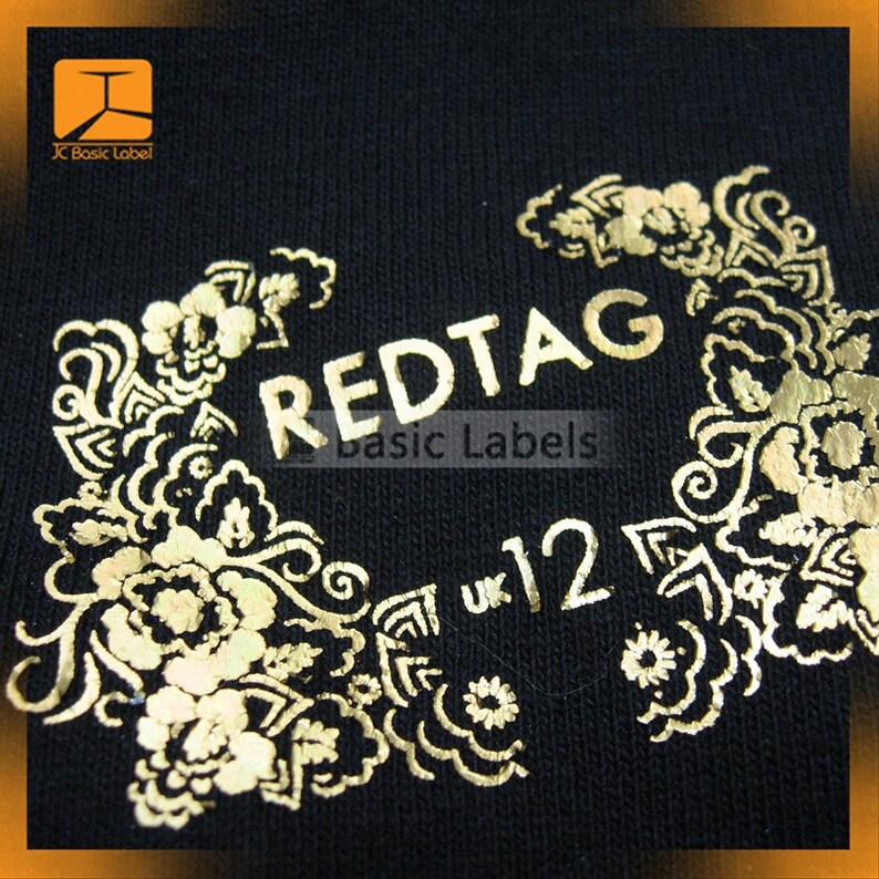 May include: Gold foil label with the text "REDTAG Basic Labels" and "UK 12" surrounded by a decorative floral design.