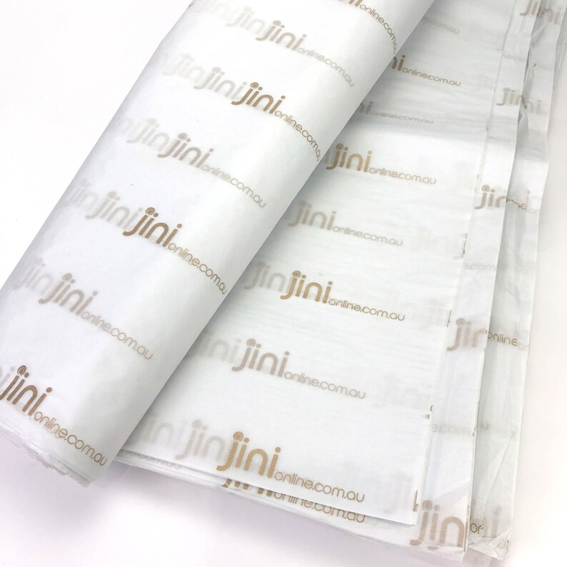 May include: White tissue paper with the text "jinjinionline.com.au" printed in gold.