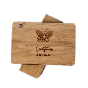May include: A wooden conditioner bar container with a butterfly logo and the text "Zero Refill" engraved on it.