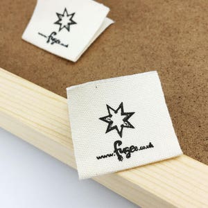 May include: White fabric label with a black star and the text "www.figse.co.uk" printed on it.