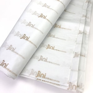 May include: White tissue paper with a repeating pattern of the text "jinjini online.com.au" printed in gold.