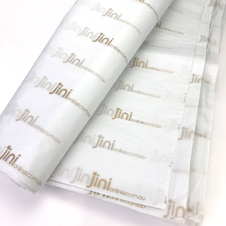 May include: White tissue paper with a repeating pattern of the text "jinjini online.com.au" printed in gold.