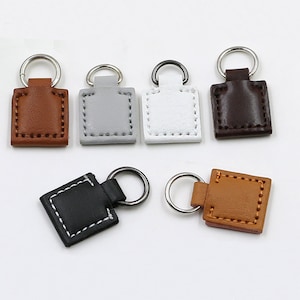 1000 PU cuero Zipper Pull Fixer Reemplazo para Tab Purse Bag Repair, disponible en varios estilos, con costuras, remaches o liso