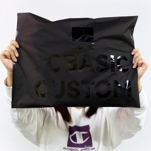 May include: A black poly mailer with the text "CBASIC CUSTOM" printed in white.