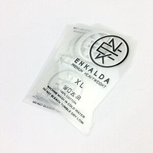 May include: White plastic packaging with a white label that says "ENKALDA PREMIUM HEAVYWEIGHT 3XL". The label also includes care instructions: "100% COTTON, MACHINE WASH IN COLD WATER, DO NOT BLEACH, TUMBLE DRY LOW".