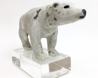 Philomena the polar bear mother of her pack handmade ceramic sculpture mounted on a acrylic ice cube block.