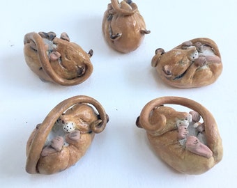 Handmade sleeping dormouse in stoneware and porcelain