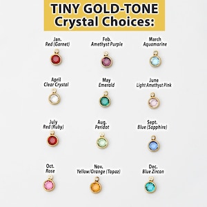 May include: A chart showing twelve tiny gold-tone crystal choices for each month of the year. The crystals are arranged in a grid with the month and corresponding crystal name listed below each crystal.
