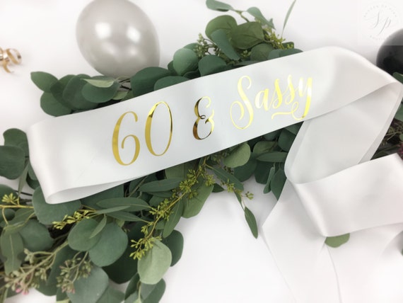 60 and Sassy Sash Supplies and Decorations ADBetty 60th Birthday Sash 60 Birthday Gifts Party Favors White Sash with Gold Foil Lettering 60 and Sassy Sash Supplies and Decorations ADBetty 60th Birthday Sash 60 Birthday Gifts Party Favors White Sash with Gold Foil Lettering