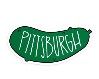May include: A green pickle sticker with the word "PITTSBURGH" written in white.