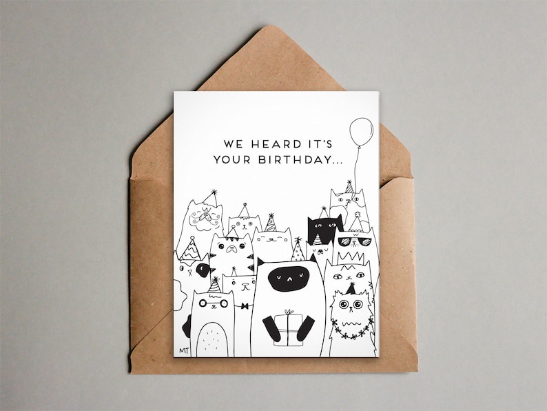 May include: A black and white birthday card with the text "We heard it's your birthday..." and a drawing of a group of cats wearing party hats and holding a gift.