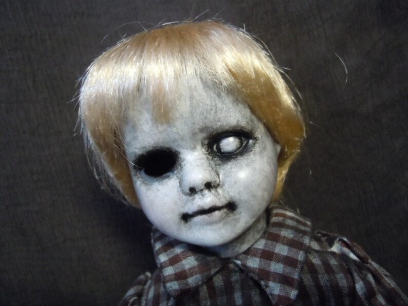 creepy boy doll