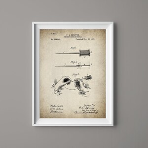 May include: A vintage patent drawing for a cricket hook or swivel. The drawing shows a close-up of the hook and a hand threading the line. The patent number is 594,340 and the date is 23 November 1897.