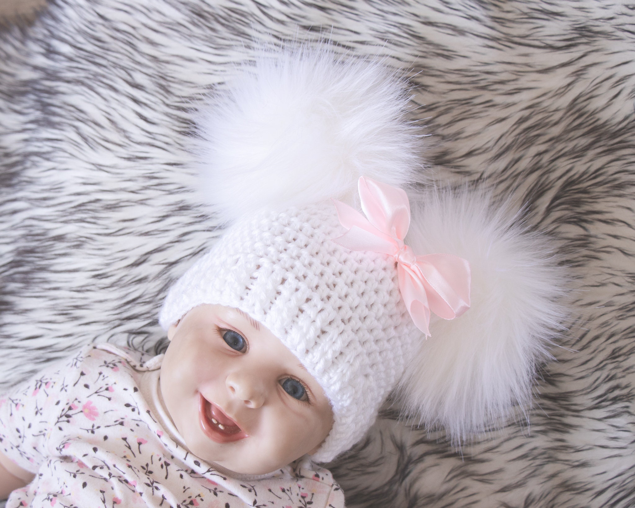 white pom pom hat baby