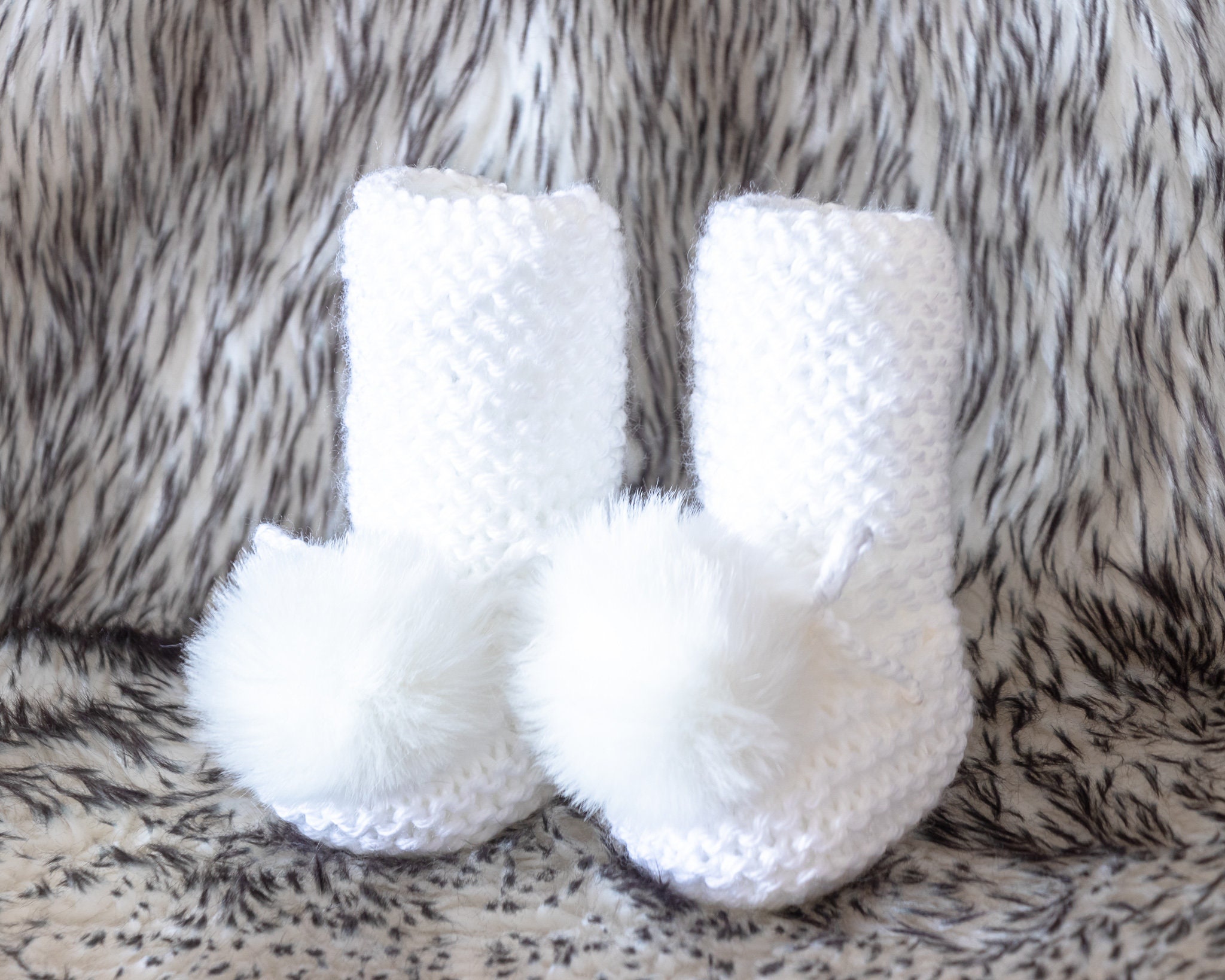 baby shoes with pom poms