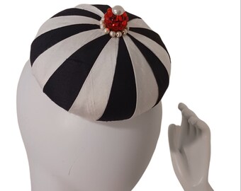 Ladie's Fascinator Pillbox black and white pleated Harlequin black and ivory with red jewel and pearls pleated button formal hat